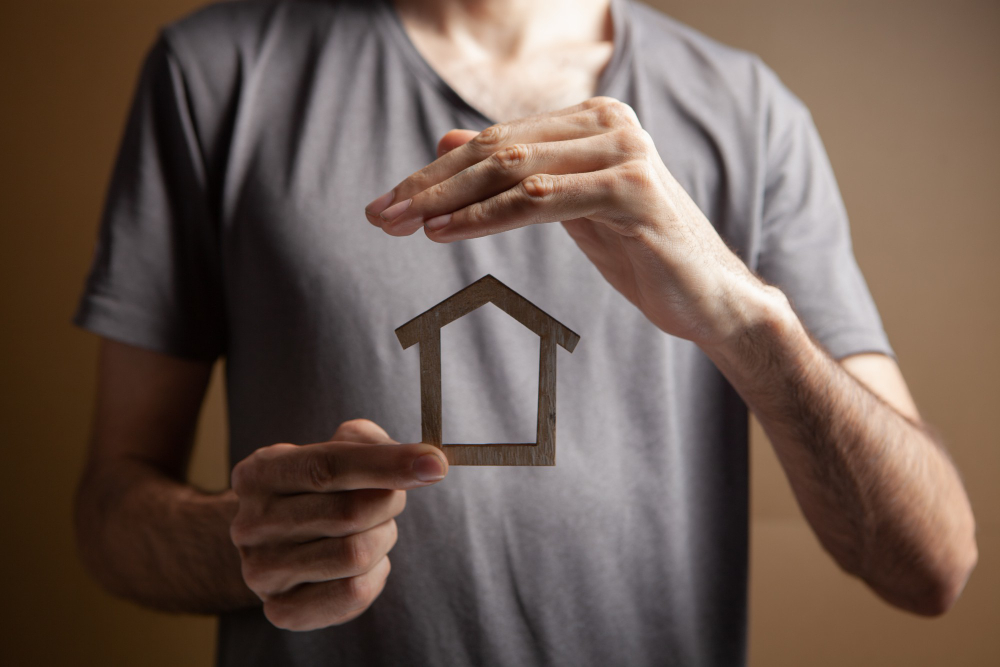 Protects House With His Hands Brown Background